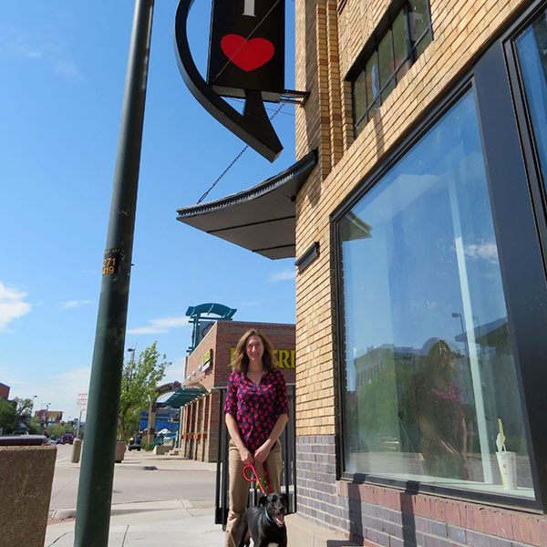 Beth next to Goodheart sign